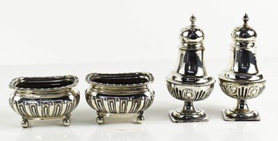 Lot 180 - A pair of silver salts, raised on ball feet,...