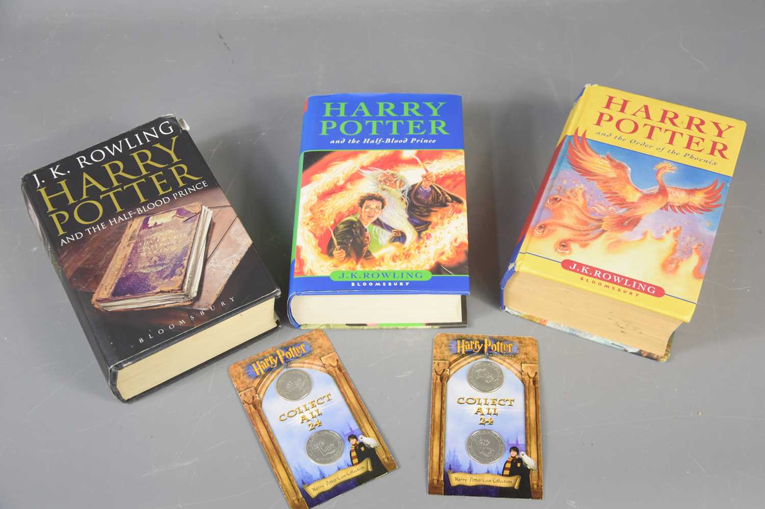 Lot 469 - Three Harry Potter first edition books "Half...