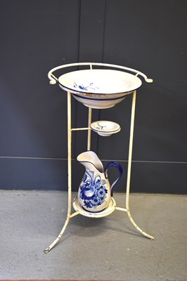 Lot 227 - A wrought iron wash stand with bowl and jug,...