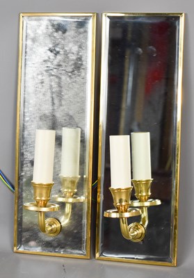 Lot 135 - A pair of mirrored brass wall sconces, each...