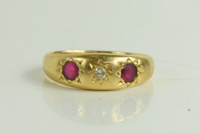 Lot 200 - An 18ct gold, ruby and diamond three stone...