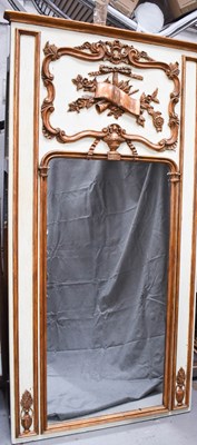 Lot 129 - A French gold and cream painted pier mirror in...