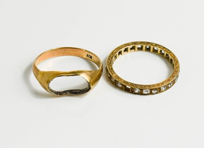 Lot 193 - Two 9ct gold rings, one eternity ring set with...