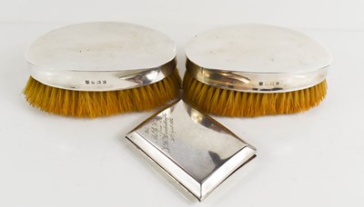 Lot 142 - A pair of silver backed clothes brushes, and a...