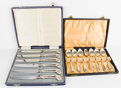 Lot 297 - A cased set of silver handled butter knives...