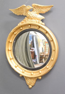 Lot 128 - A late 19th century convex wall mirror with a...