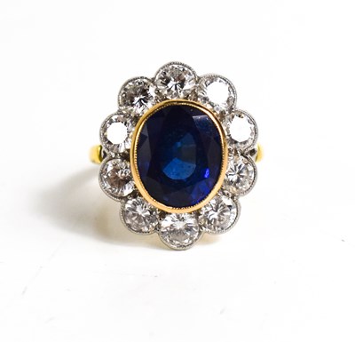 Lot 299 - An 18ct yellow gold, sapphire and diamond ring,...