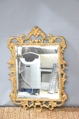 Lot 125 - An early 20th century giltwood wall mirror...