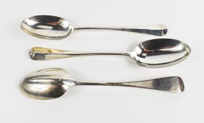 Lot 307 - A set of three Edwardian silver serving spoons...