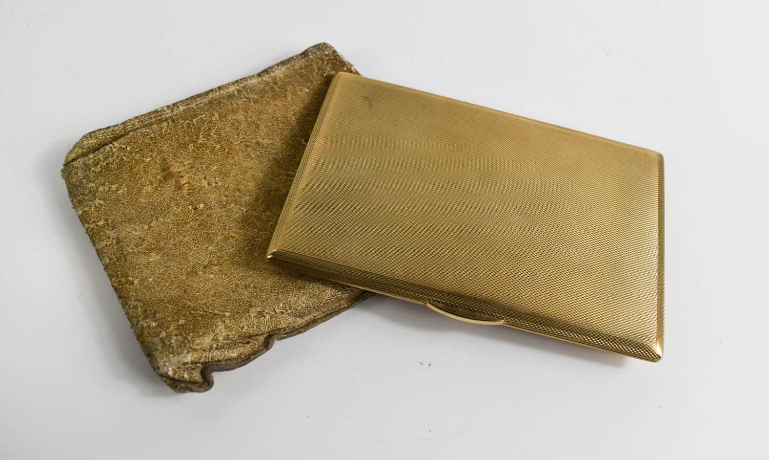 Lot 319 - A 9ct gold cigarette case, with engine turned...