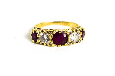 Lot 323 - An 18ct gold, ruby and diamond ring, the two...