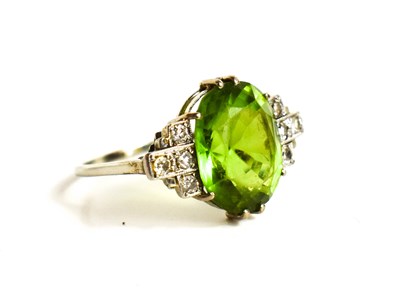 Lot 325 - A white gold Art Deco peridot or possibly...