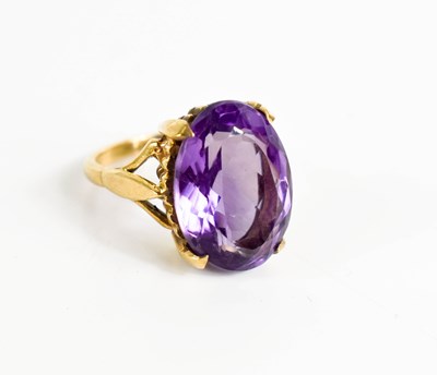 Lot 327 - A 9ct gold and amethyst dress ring, the oval...