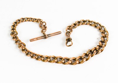 Lot 329 - A 9ct rose gold Albert chain with twist curb...