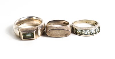 Lot 332 - A set of three silver rings, with one set with...