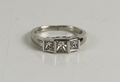 Lot 366 - A platinum and diamond three stone ring, the...