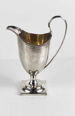 Lot 370 - A George III silver helmet form milk jug by...