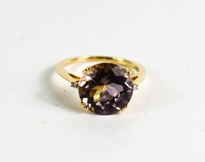 Lot 364 - A 9ct gold, Ametrine and diamond ring, with a...