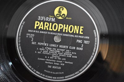 Lot 111 - A group of Beatles LPs and 7" single records,...