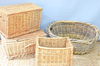 Lot 559 - A vintage wicker oval basket together with two...