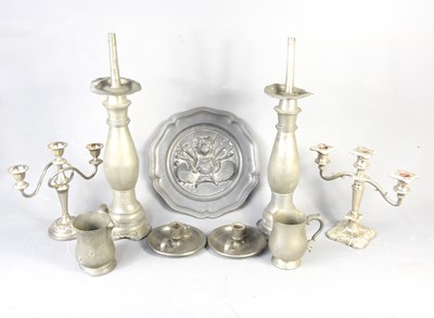 Lot 391 - A pair of 19th century pewter candlesticks,...