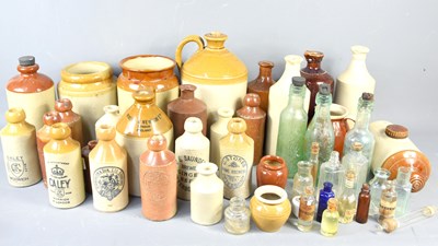 Lot 218 - A large group of stoneware flagons and bottles...