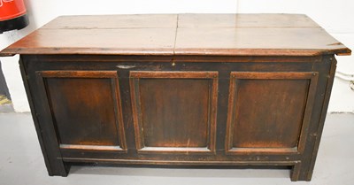 Lot 581 - A late 18th century oak chest, with planked,...