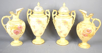 Lot 121 - A set of four cream ground vases and ewers,...