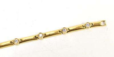 Lot 44 - An 18ct gold and white gemset bracelet, 20cm...