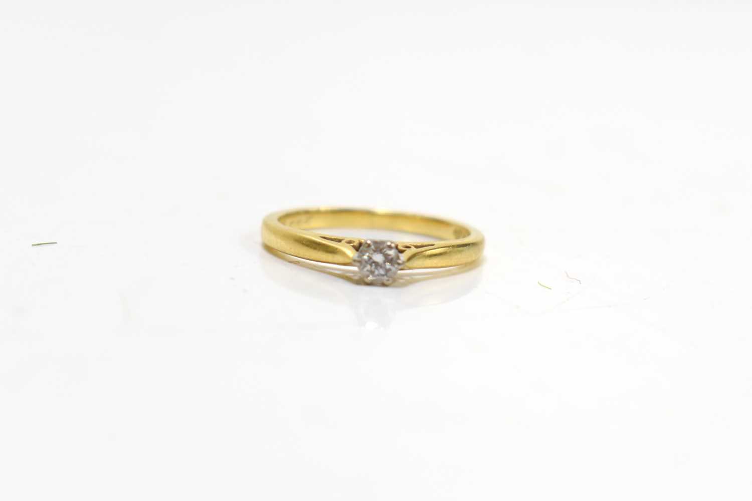 Lot 43 - An 18ct gold and diamond solitaire ring, size...