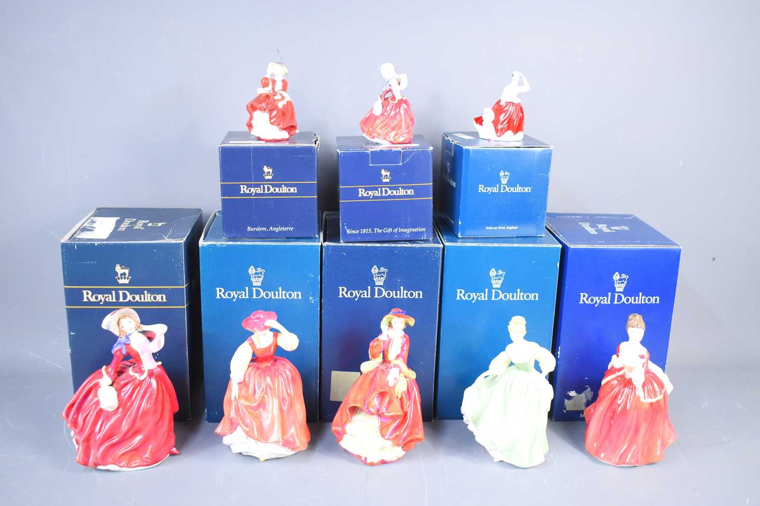 Lot 202 - A group of Royal Doulton figurines to include...