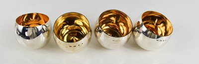 Lot 117 - Chris Knight: a set of four silver tumblers...