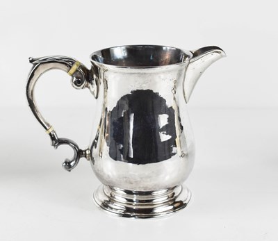 Lot 2 - An early George III silver jug, of baluster...