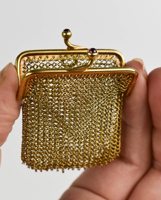 Lot 41 - A 9ct gold mesh coin purse with ruby cabochon...