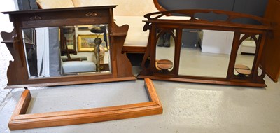 Lot 575 - An Arts and Crafts oak overmantle mirror in...