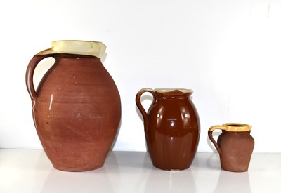 Lot 134 - A group of three stoneware jugs, three moulds...