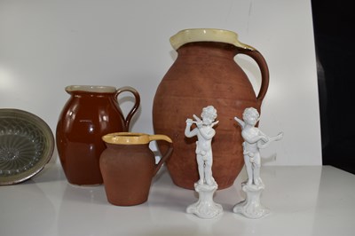 Lot 134 - A group of three stoneware jugs, three moulds...