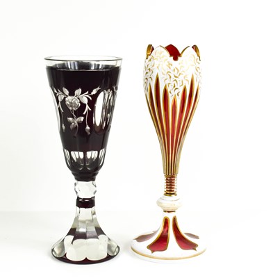 Lot 133 - A cranberry glass goblet, likely Austrian,...