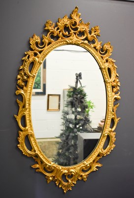 Lot 286 - A 20th century giltwood style mirror of oval...