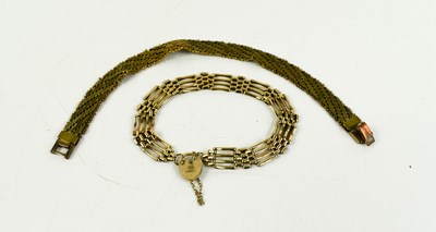 Lot 138 - A 9ct gold gatelink charm bracelet with heart...