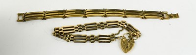 Lot 141 - A 9ct gold gatelink charm bracelet with heart...