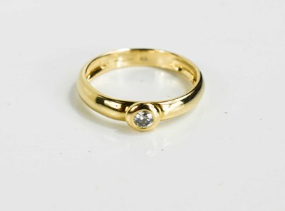 Lot 135 - An 18ct gold and diamond solitaire ring with...