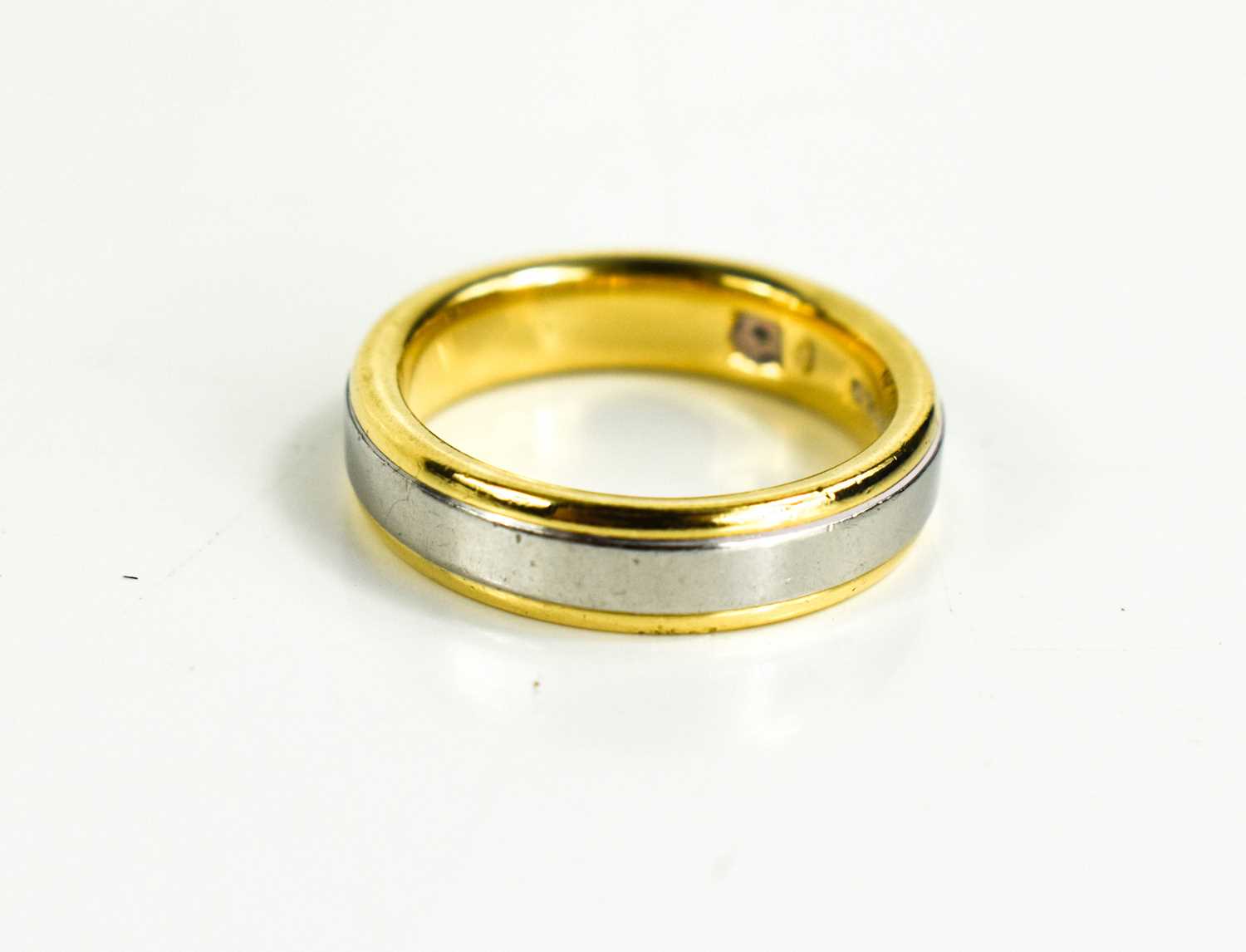 Lot 142 - An 18ct gold and diamond bi-colour ring, size...