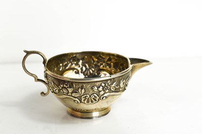 Lot 310 - A Victorian small silver cream jug, of cup...