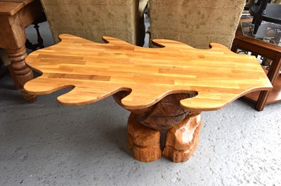 Lot 534 - A handmade oak leaf shaped table, 123cm long,...