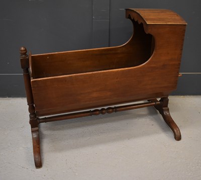 Lot 565 - A 19th century mahogany childrens cradle, with...