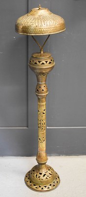 Lot 573 - A 19th century brass Indonesian lamp, possibly...