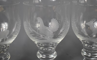 Lot 146 - A set of six glasses, each etched with an...