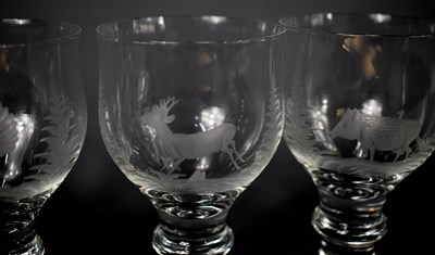 Lot 146 - A set of six glasses, each etched with an...