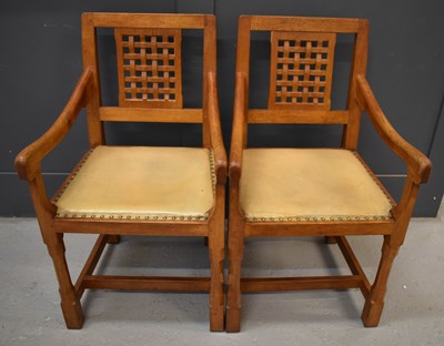 Lot 587 - A pair of Rabbit Man adzed oak carver chairs,...